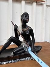 Antique style Statue of a woman in a canoe 1920